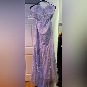 Purple strapless prom dress with flower and gem detailing